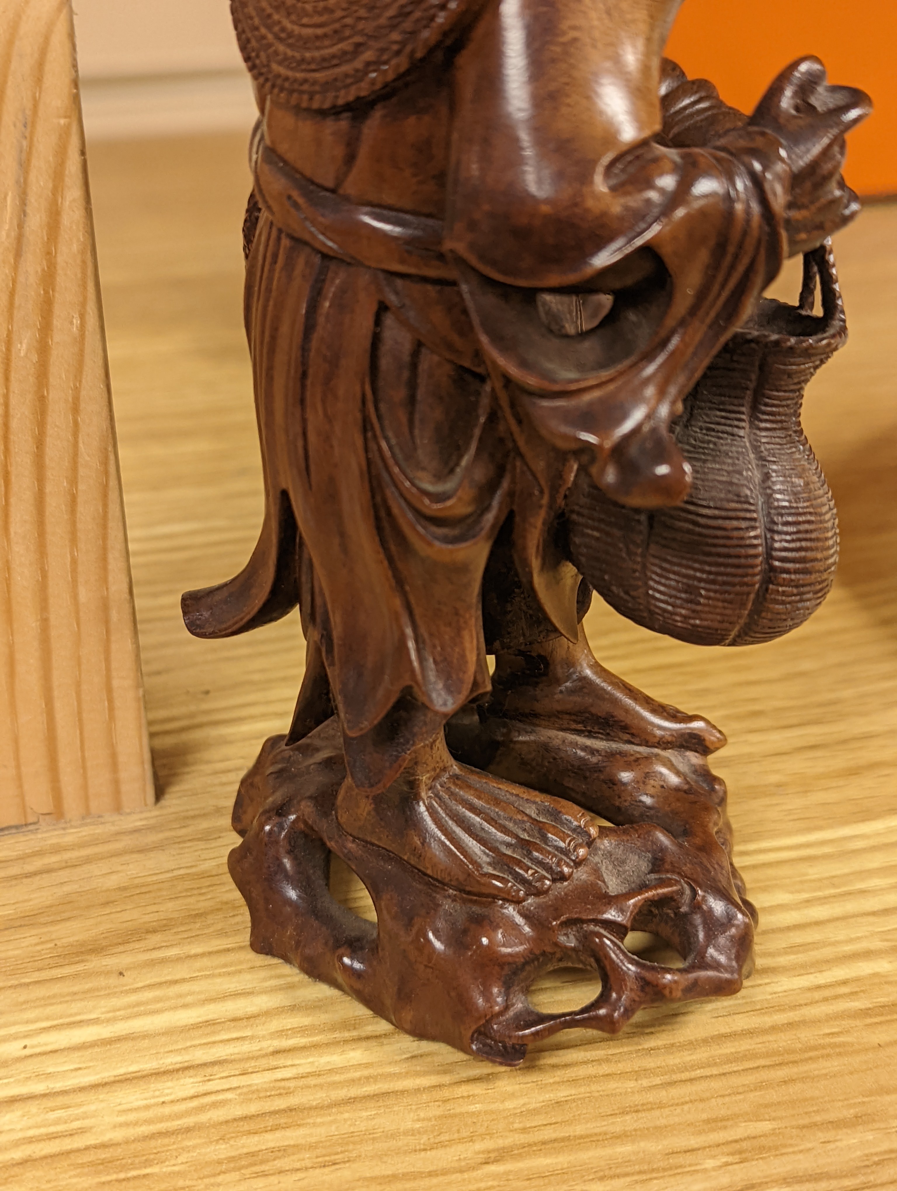 Two Chinese hardwood figures of a fisherman and a old man holding peaches 16cm